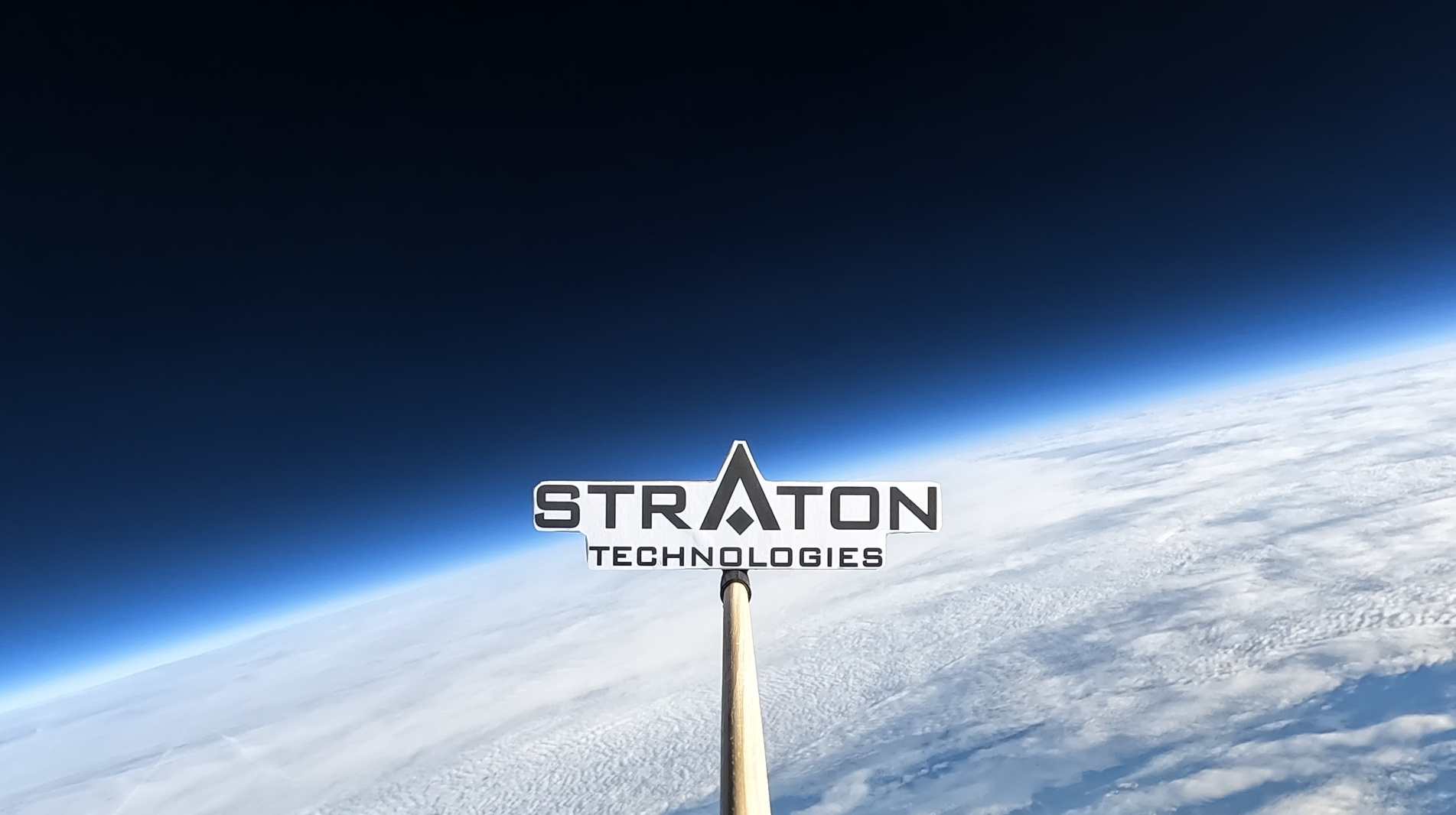 Straton brand mark above the curvature of Earth
