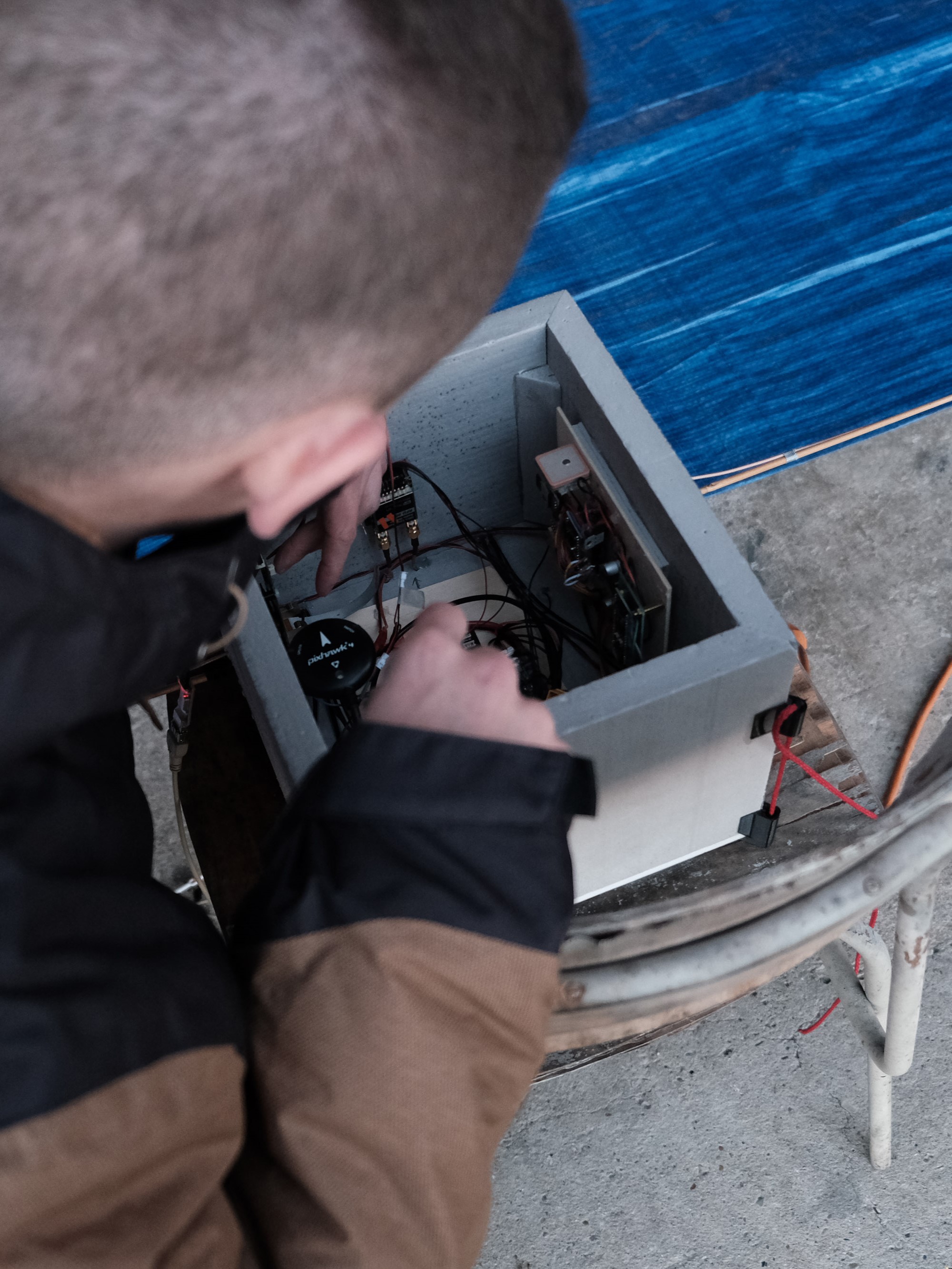 Technician assembling a payload gondola